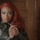 Megan thee Stallion with a mounted severed head